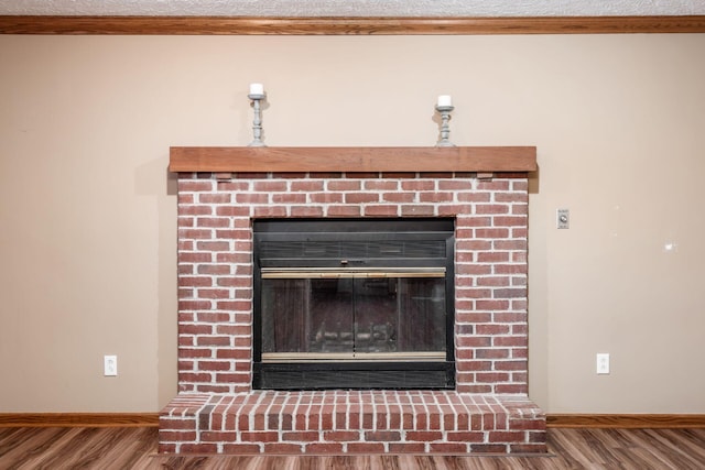 details with wood-type flooring and a fireplace