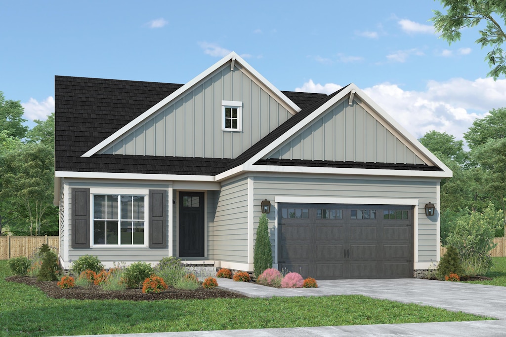 view of front of property with board and batten siding, concrete driveway, roof with shingles, and a garage