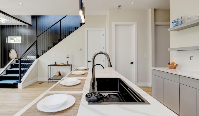 kitchen featuring hanging light fixtures and light hardwood / wood-style floors