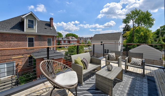 wooden deck with an outdoor living space