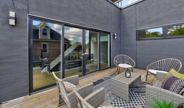 wooden terrace featuring an outdoor living space