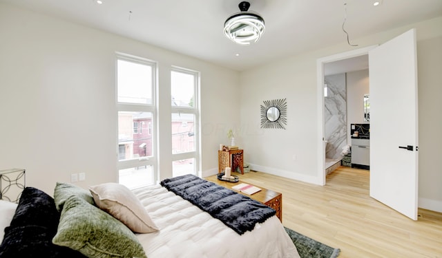 bedroom with light hardwood / wood-style flooring