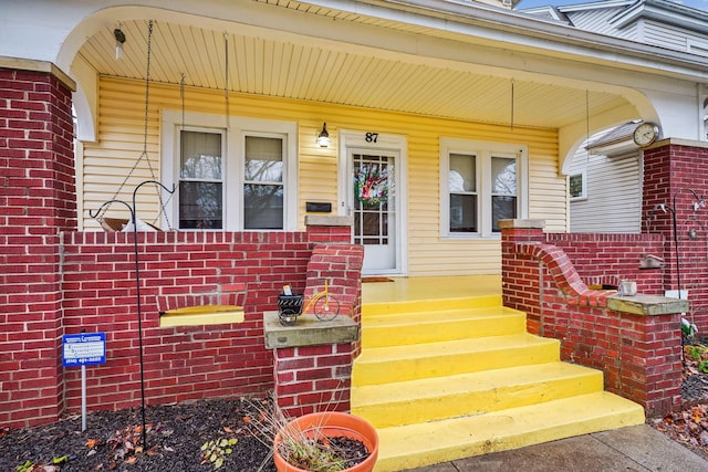 entrance to property with covered porch