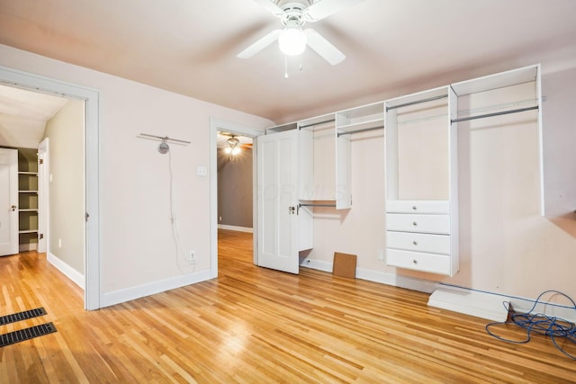 unfurnished bedroom featuring light hardwood / wood-style flooring and ceiling fan