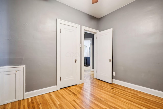 unfurnished room featuring light hardwood / wood-style flooring and ceiling fan