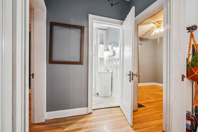 hallway featuring light hardwood / wood-style flooring