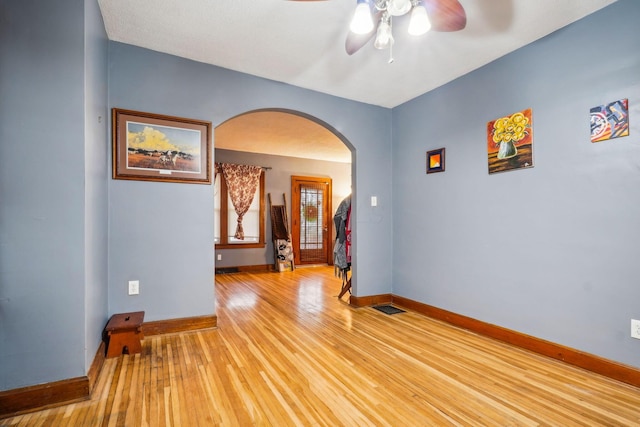 unfurnished room featuring ceiling fan and light hardwood / wood-style floors