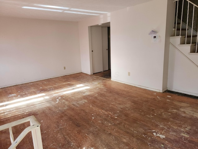 spare room featuring dark hardwood / wood-style flooring