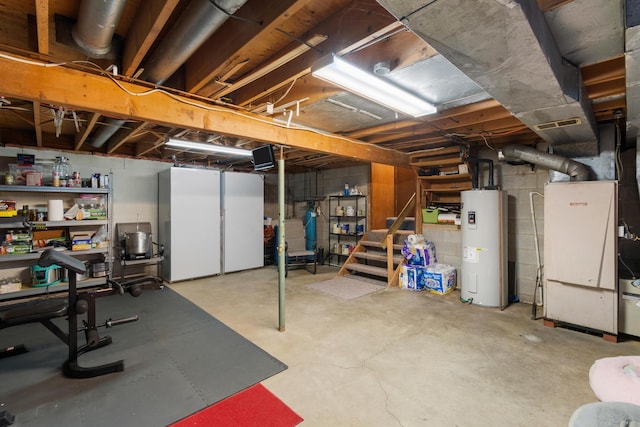 basement featuring heating unit and water heater