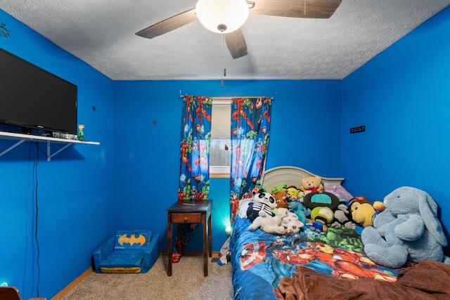 bedroom featuring carpet, a textured ceiling, and ceiling fan