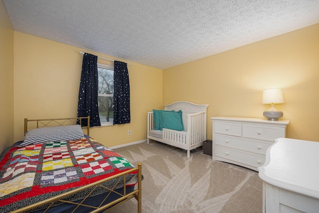 carpeted bedroom with a textured ceiling