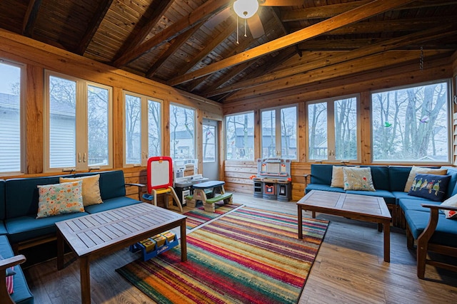 sunroom featuring vaulted ceiling with beams, ceiling fan, and wood ceiling