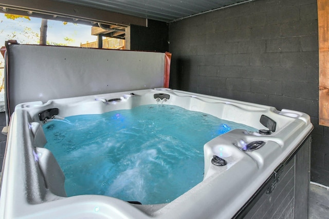 14485 Jack Run Rd, Rockbridge, OH 43149 - misc room with a jacuzzi and concrete block wall