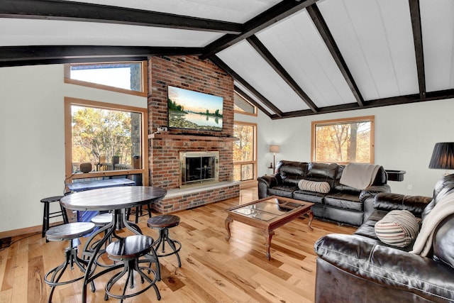 14485 Jack Run Rd, Rockbridge, OH 43149 - living room with hardwood / wood-style flooring, a brick fireplace, plenty of natural light, and baseboards