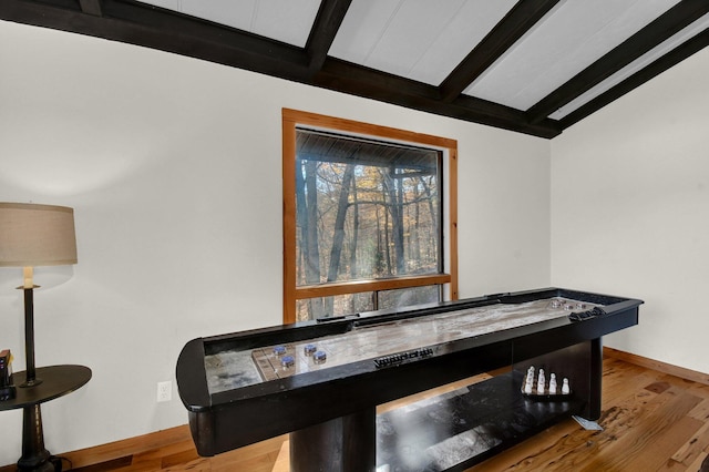 14485 Jack Run Rd, Rockbridge, OH 43149 - detailed view of beamed ceiling, baseboards, and wood finished floors