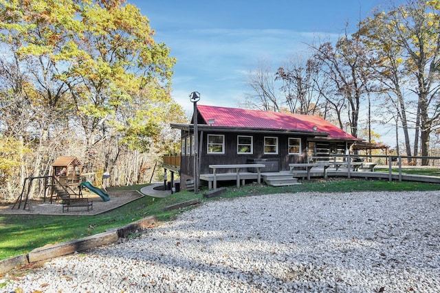 14485 Jack Run Rd, Rockbridge, OH 43149 - rear view of property featuring metal roof, a playground, and a wooden deck