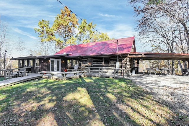 14485 Jack Run Rd, Rockbridge, OH 43149 - rear view of house with metal roof, a lawn, french doors, and log exterior
