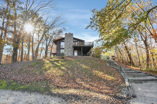 14485 Jack Run Rd, Rockbridge, OH 43149 - view of side of home featuring a chimney and a deck