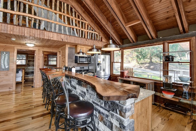 14485 Jack Run Rd, Rockbridge, OH 43149 - bar featuring appliances with stainless steel finishes, light wood-style floors, wood ceiling, wood walls, and decorative light fixtures