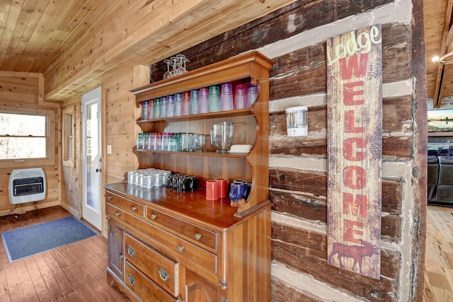 14485 Jack Run Rd, Rockbridge, OH 43149 - detailed view of heating unit, wood finished floors, wooden walls, and wood ceiling