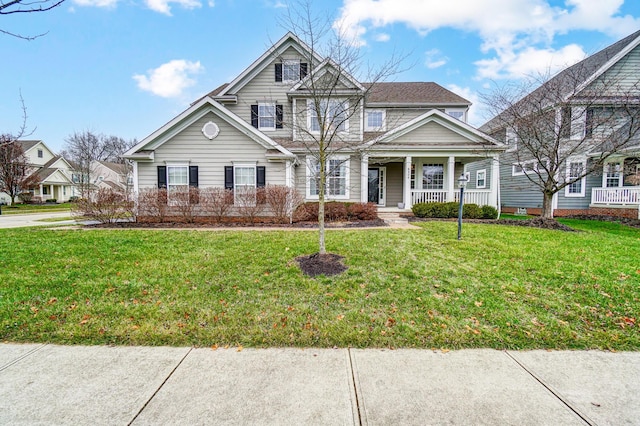 view of front of house featuring covered porch and a front yard