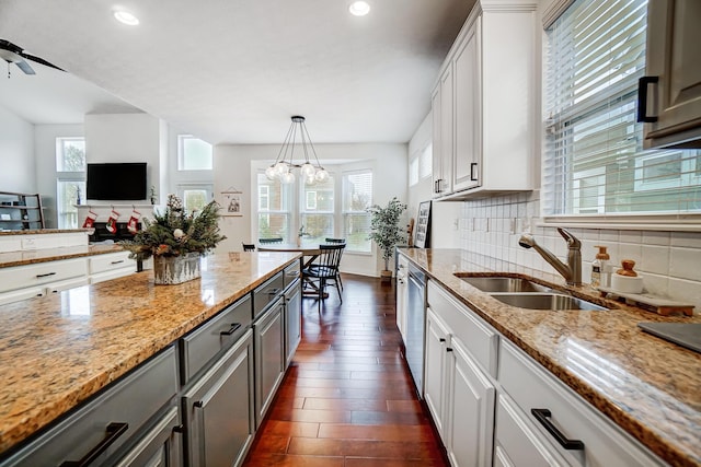 kitchen with gray cabinetry, plenty of natural light, white cabinetry, and sink