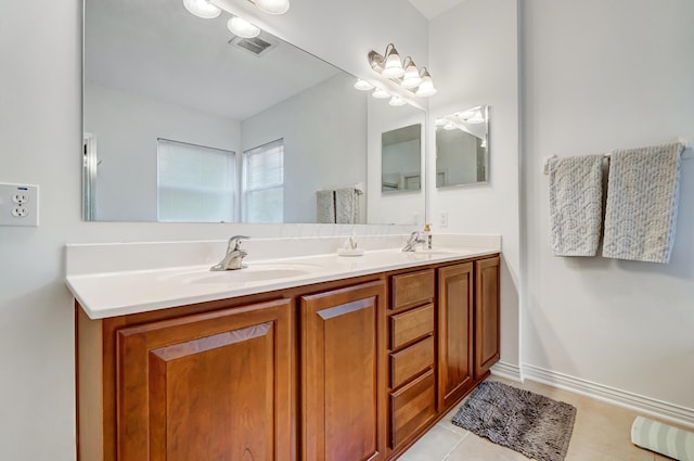 bathroom featuring tile patterned floors and vanity