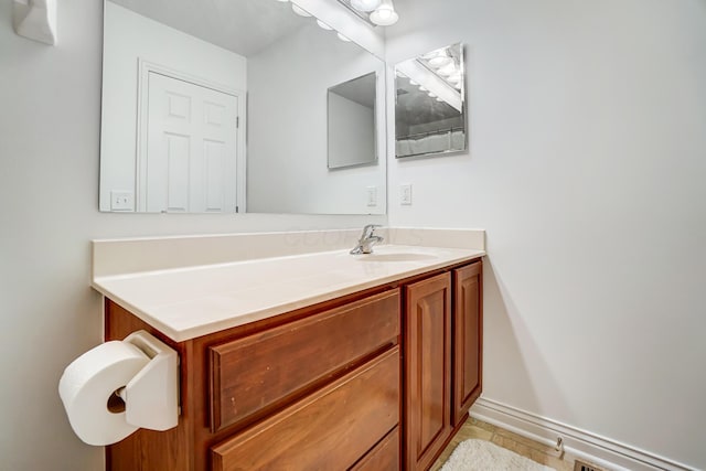 bathroom with tile patterned floors and vanity