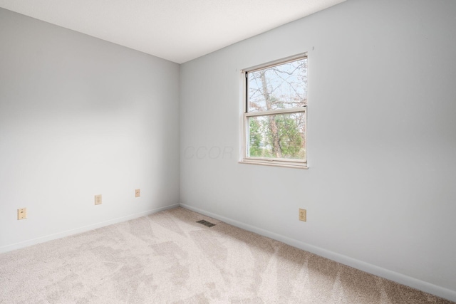 empty room with light colored carpet