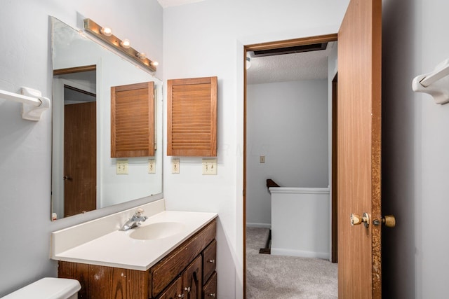 bathroom featuring vanity and a textured ceiling