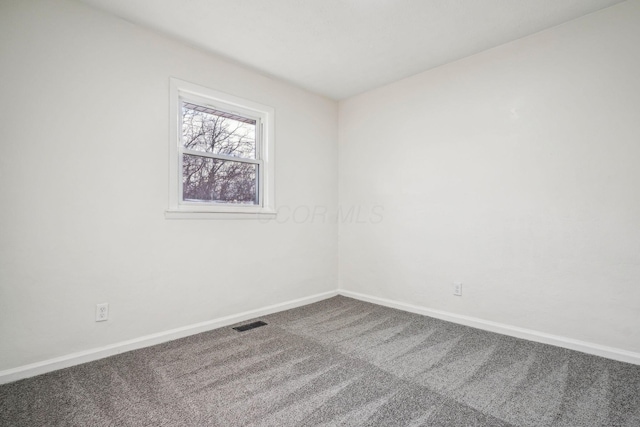 empty room featuring carpet floors