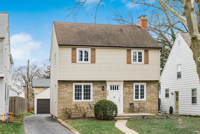 view of front of home featuring an outbuilding and a garage