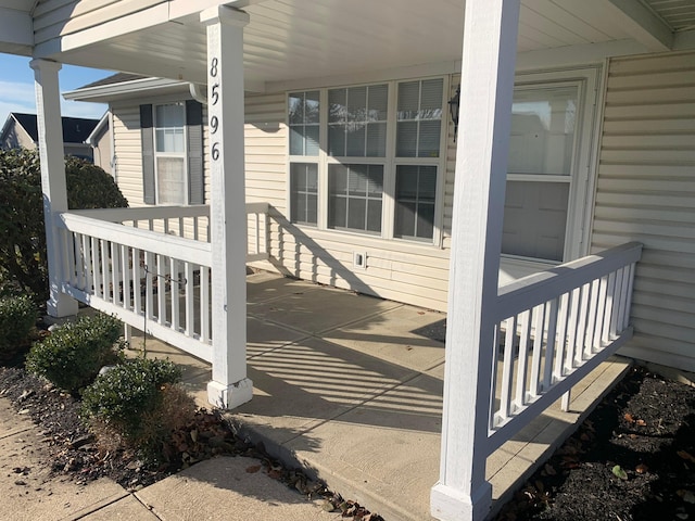 wooden terrace with a porch