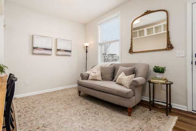 sitting room with hardwood / wood-style flooring