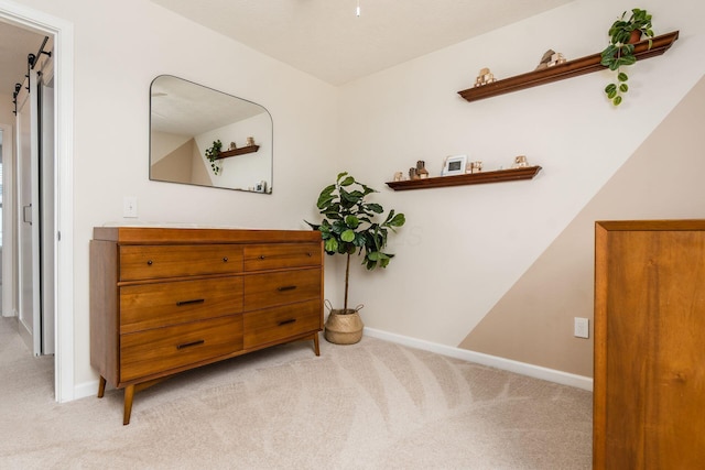 hallway with light colored carpet