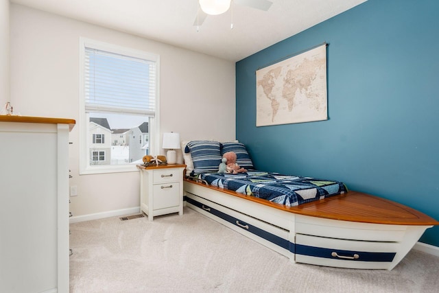 bedroom with light carpet and ceiling fan