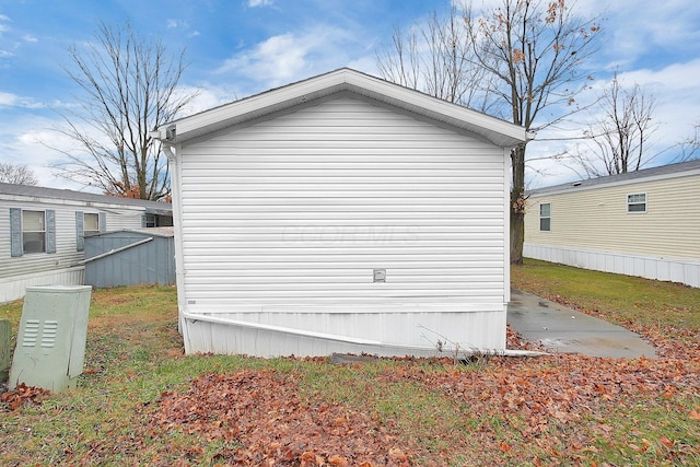 view of home's exterior with a yard