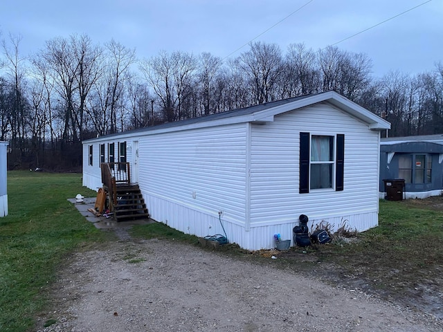 view of property exterior featuring a yard