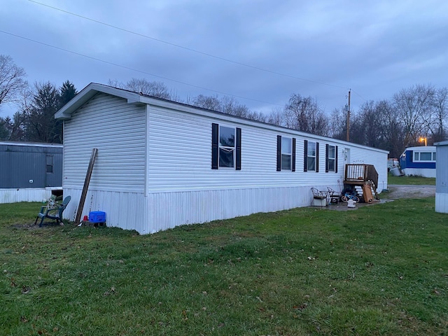 view of home's exterior featuring a yard