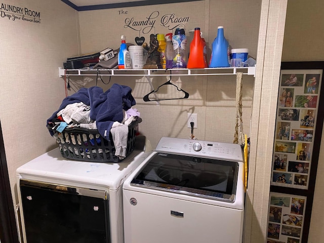 laundry area with separate washer and dryer