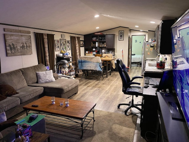 office featuring light hardwood / wood-style flooring and lofted ceiling