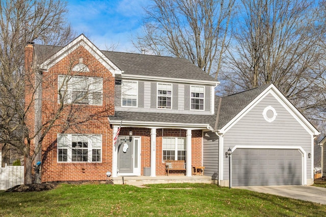 view of front of property with a garage and a front lawn