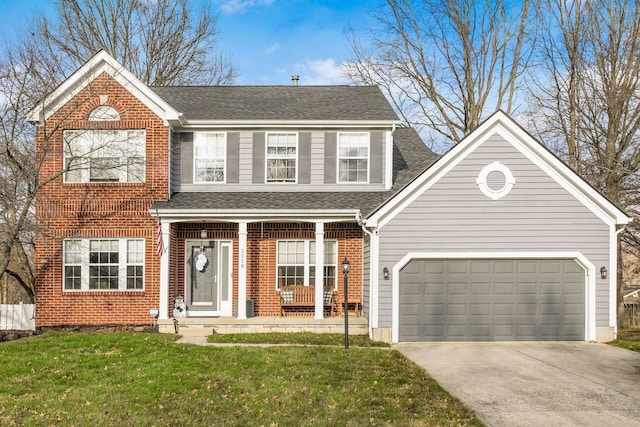 view of front of house featuring a front lawn and a garage