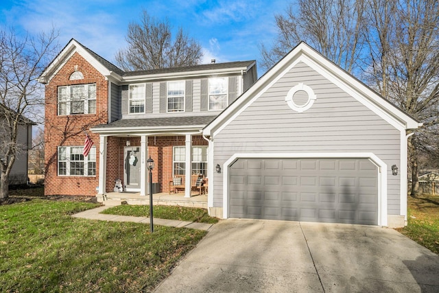 front of property featuring covered porch, a garage, and a front lawn