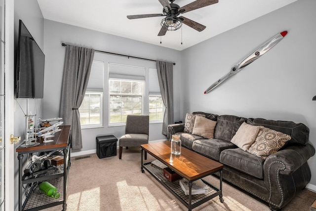 living room with ceiling fan and carpet floors