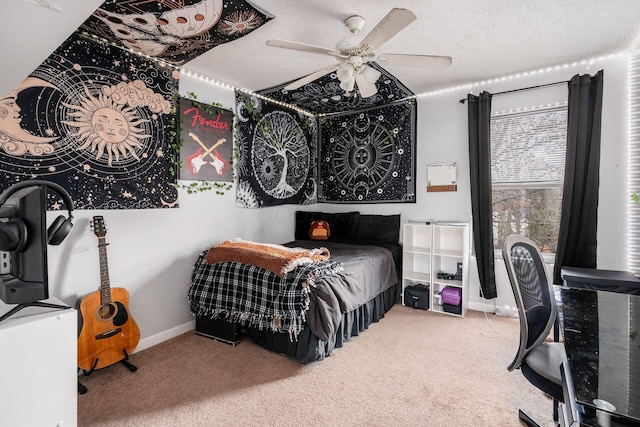 carpeted bedroom with a textured ceiling and ceiling fan