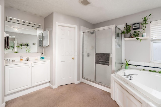 bathroom featuring vanity, plus walk in shower, and a textured ceiling