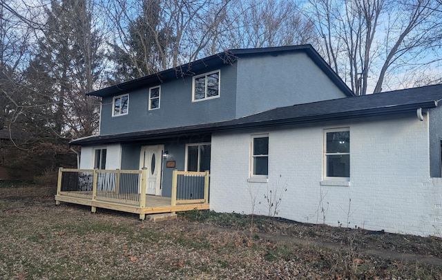 rear view of house with a deck