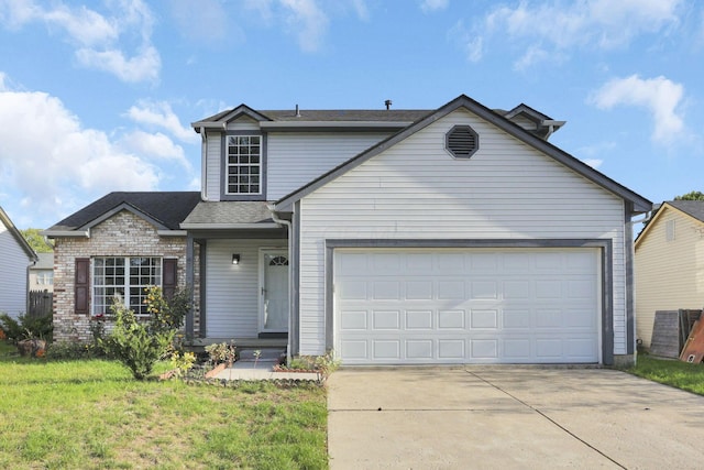 view of front property featuring a front lawn and a garage