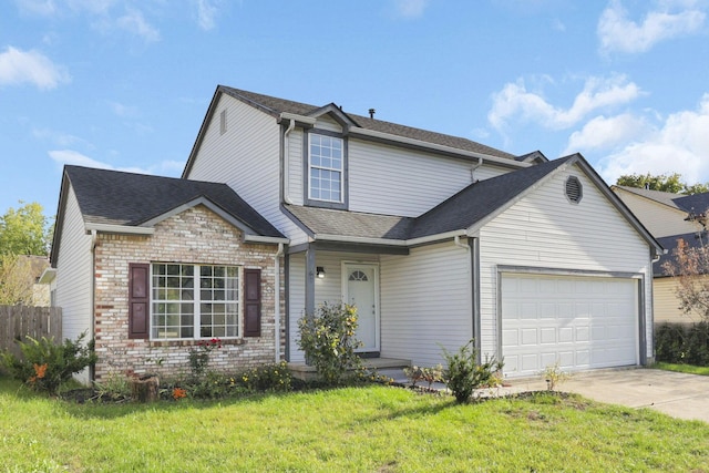 view of front property with a garage and a front yard